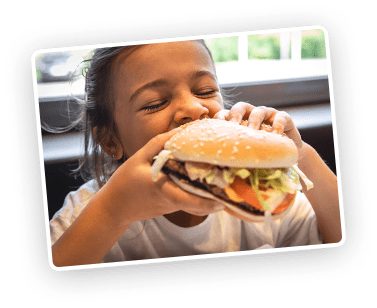 child eating burger
